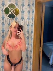 Sultry blonde takes self shots while sporting a strapon cock