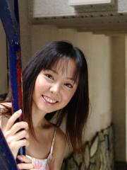 Sweet Japanese teen Yui Hasumi wears a smile while showing her hairy bush
