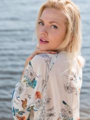 Blonde sweetie Camelia shows her fine body and poses in the sea