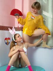 Sweet teen lesbians Masha C and Karin A play with sex toys in their room