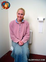 Horny white girl Jamie Woods sucks off a black cock via a gloryhole