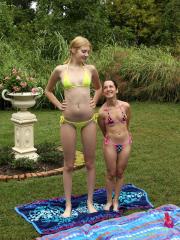 Brunette Freya Von Doom and a tall blonde lick and rub each other's cunts