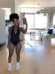 Cute ebony girl with an ass to die for sticks her tongue out in the nude