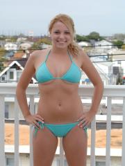 Luscious blonde Crystal flashing her natural boobs and bald pussy in public