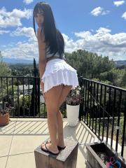 Latina amateur displays her landing strip pussy with long hair and bare feet