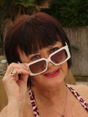 Dark-haired granny Mona strips poolside and shows her hairy holes