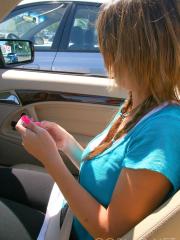 Cutie Britt Phillips in pigtails removing her top to sun her big titties