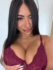 Solo girl with dark hair and tattoos frees her big butt from sensual lingerie