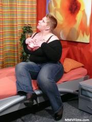 Big fatty Lucie unveils big pierced nipples & tugs cum onto her massive juggs