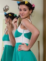 Cute teen Ramira uncovers big natural tits before freeing bush from pantyhose