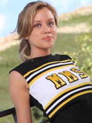 Sexy cheerleader Summer strips on the balcony and flaunts her fantastic body