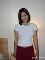 Asian with hairy bush Mei grabs her clit and fingers her wet pussy