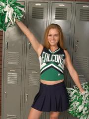 Teen cheerleader gets totally naked in front of change room lockers
