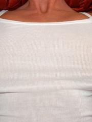 Blonde MILF with huge tits Kelly Madison masturbates on red bed