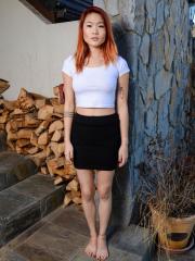 Asian teen with red hair Lea Hart gets bare naked outdoors by herself