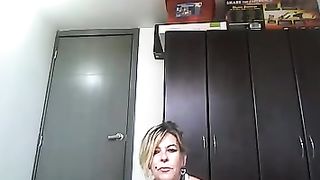 Mature blonde in tight white leggings is provoking her guy who is behind the camera