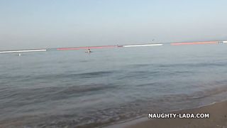 Naughty girl likes going to the beach and naughty guys like looking at her sheer bikini