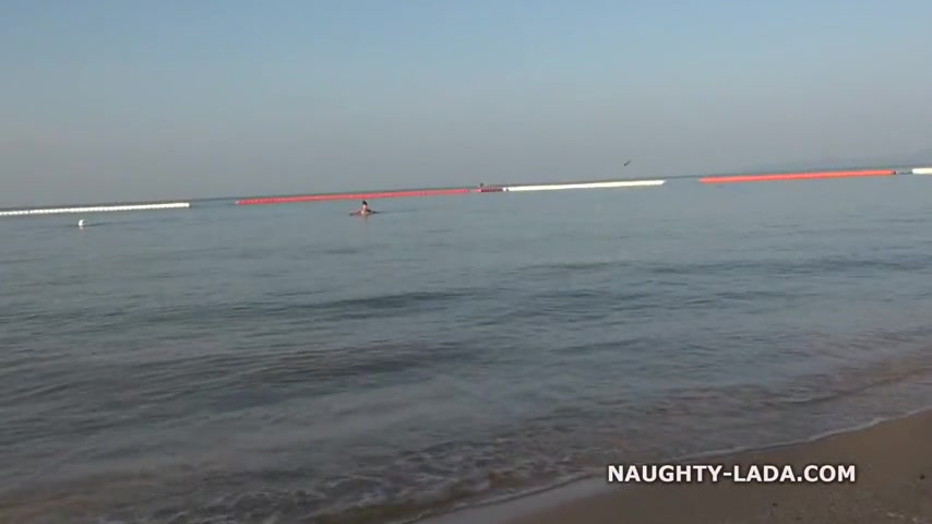 Naughty girl likes going to the beach and naughty guys like looking at her sheer bikini