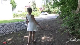 Simple girl, in a dress is sitting on the bench and rubbing her wet pussy, by the lake