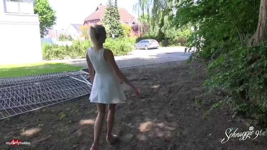 Simple girl, in a dress is sitting on the bench and rubbing her wet pussy, by the lake