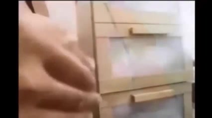 Busty woman is squeezing her milk jugs and feeding her kinky lover while rubbing his dick