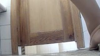 Young girls pee in the toilet 221