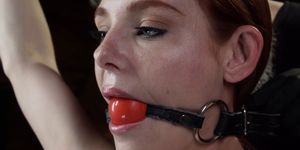 Gagged redhead tormented in hogtie