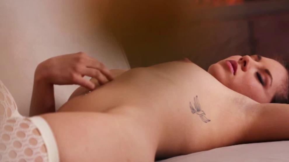 Classy brunette working her clit