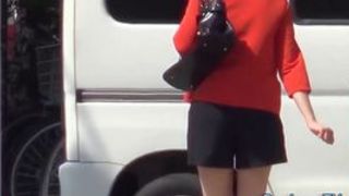 High heeled asian ho pees on road