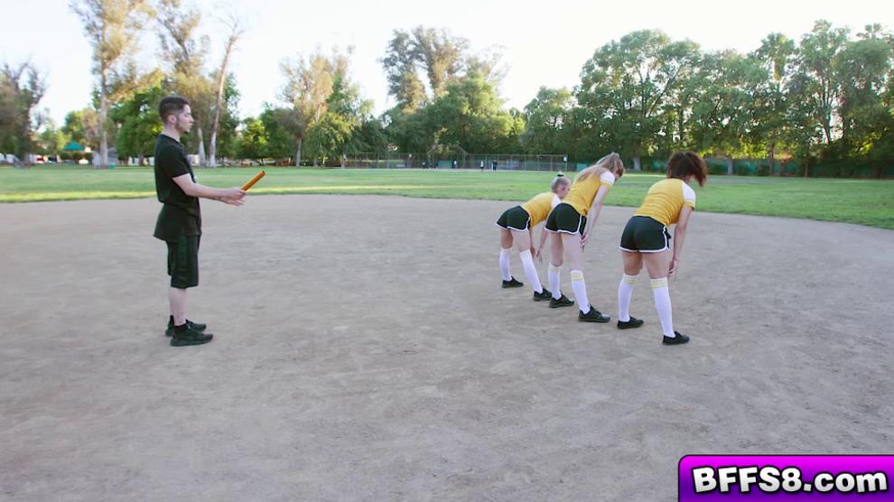 The teens moan as they bend over and let their coach stuff their pussies