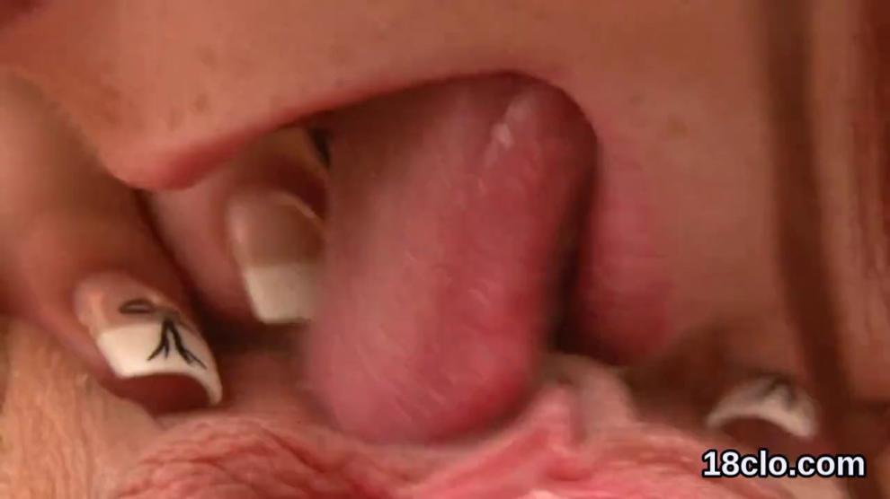 Lovely teenie is gaping wet twat in close up and climaxing