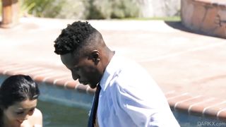 Japanese babe seducing a black guy in the pool