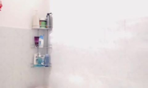 Brunette with big boobs in the shower