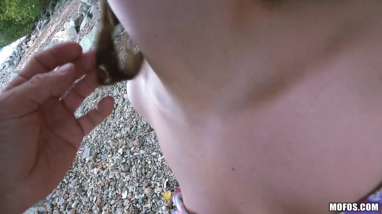 Two babes suck two cocks outdoors