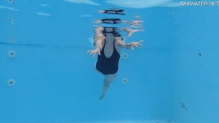 Blonde tattooed tight petite babe Mimi Cica swims clothes free