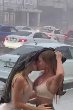 Pouring rain girlskissing