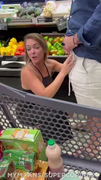A couple is having fun right in the market PublicBlowjobs